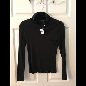 Lauren Ralph Lauren long sleeved rolled neck top with side buttons at neck.